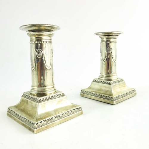 61 - A pair of Victorian silver dwarf candlesticks, Goldsmiths and Silversmiths Co., London 1900, Neoclas... 