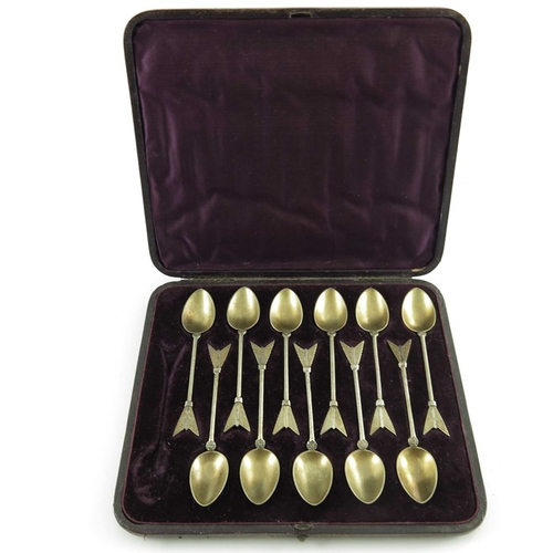 65 - A set of eleven Victorian silver gilt teaspoons, Martin, Hall and Co., Sheffield 1874, cast in the f... 