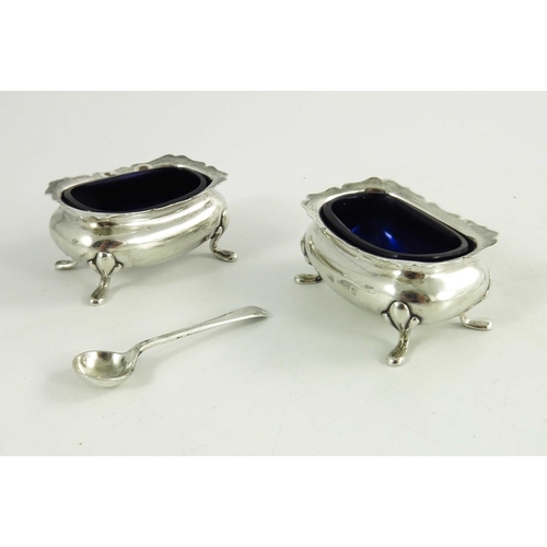 69 - A pair of Edwardian silver salt cellars and spoon, Robert Pringle and Sons, Birmingham 1905, rectang... 