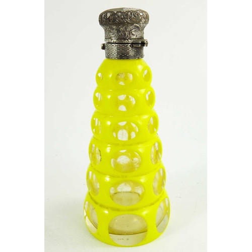 83 - A white metal mounted yellow over colourless cased glass scent bottle, 19th century, probably Bohemi... 