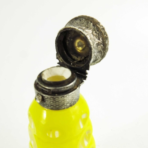 83 - A white metal mounted yellow over colourless cased glass scent bottle, 19th century, probably Bohemi... 