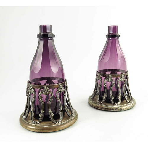 9 - A pair of William IV amethyst glass decanters in original Old Sheffield Plate coasters, circa 1835, ... 