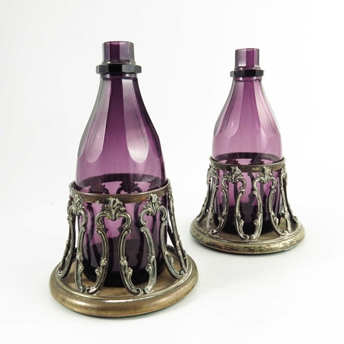 9 - A pair of William IV amethyst glass decanters in original Old Sheffield Plate coasters, circa 1835, ... 