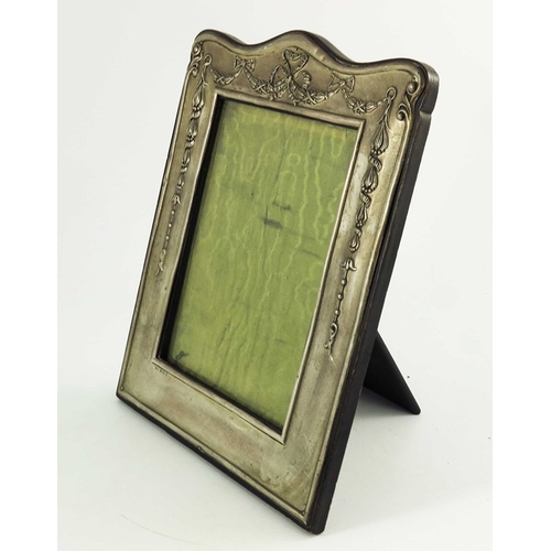 96 - A large Edwardian silver photo frame, William Neale, Birmingham 1910, embossed with festoons and rib... 