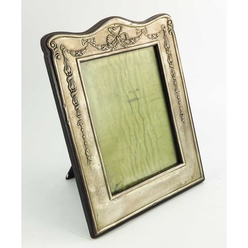 96 - A large Edwardian silver photo frame, William Neale, Birmingham 1910, embossed with festoons and rib... 