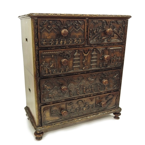 223 - An early 19th century Chinese carved hardwood campaign chest of two short over three long drawers, c... 