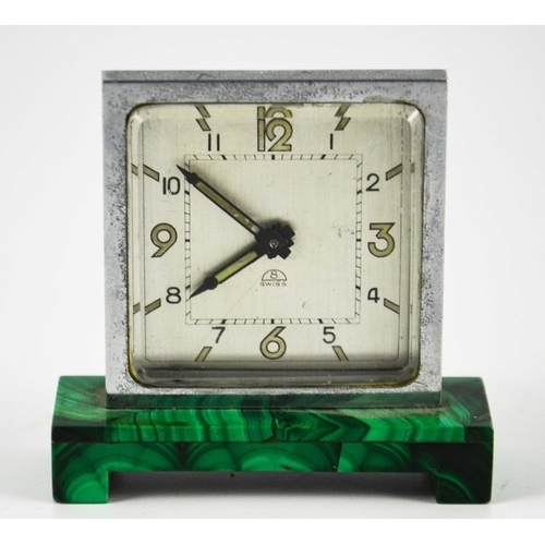 259 - An Art Deco malachite and chrome timepiece, circa 1930, the square silvered clock face with luminesc... 