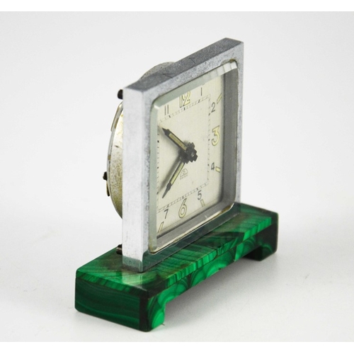 259 - An Art Deco malachite and chrome timepiece, circa 1930, the square silvered clock face with luminesc... 