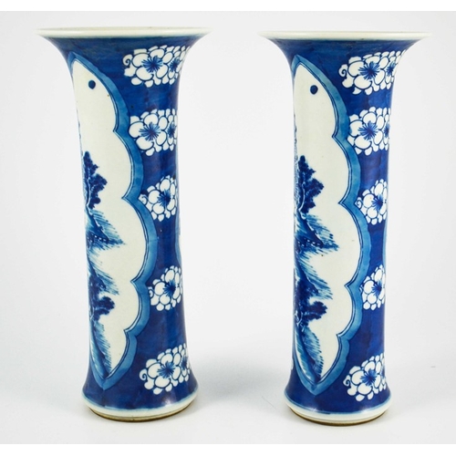 383 - A pair of Chinese blue and white sleeve vases, flared trumpet form, prunus grounds with lobed navett... 