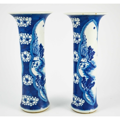 383 - A pair of Chinese blue and white sleeve vases, flared trumpet form, prunus grounds with lobed navett... 