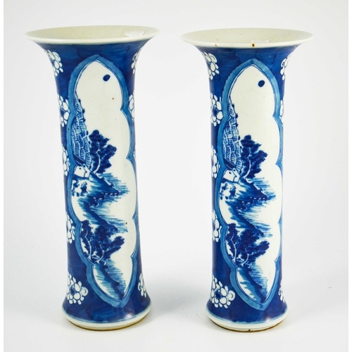 383 - A pair of Chinese blue and white sleeve vases, flared trumpet form, prunus grounds with lobed navett... 