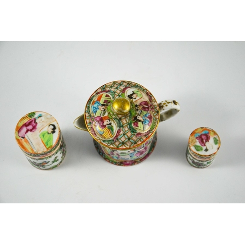 399 - A Chinese famille rose small teapot and two cylindrical jars, Cantonese, probably 19th century, deco... 