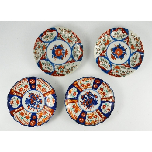 404 - An Imari charger, decorated with garden scenes, together with seven similar plates, charger 45cm dia... 