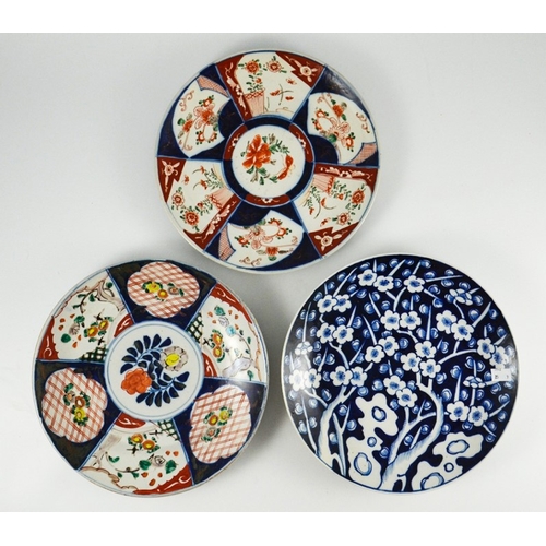 404 - An Imari charger, decorated with garden scenes, together with seven similar plates, charger 45cm dia... 