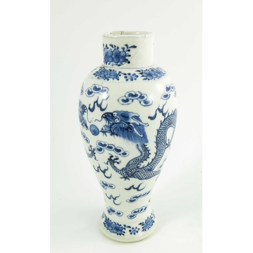 406 - A Chinese blue and white vase, Kangxi mark, baluster form, painted with two four-clawed dragons amid... 