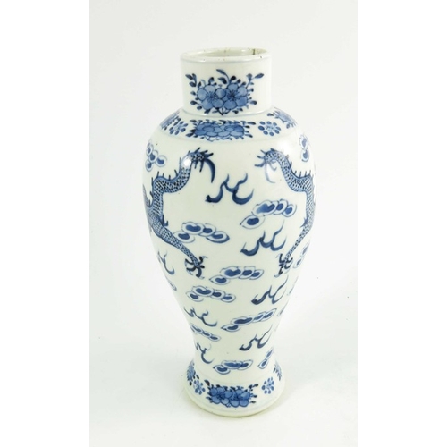 406 - A Chinese blue and white vase, Kangxi mark, baluster form, painted with two four-clawed dragons amid... 