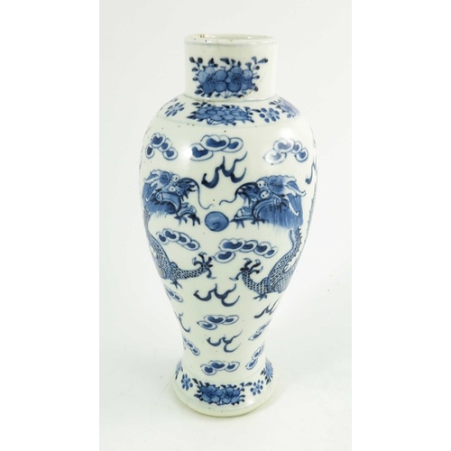 406 - A Chinese blue and white vase, Kangxi mark, baluster form, painted with two four-clawed dragons amid... 