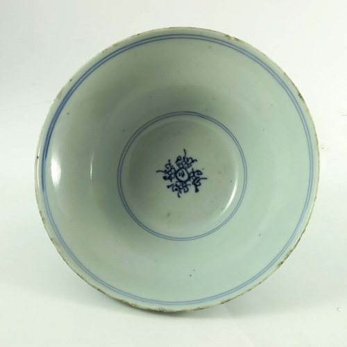 411 - A Chinese blue and white bowl, Ming, ogee form, painted with prunus, 18cm diameter