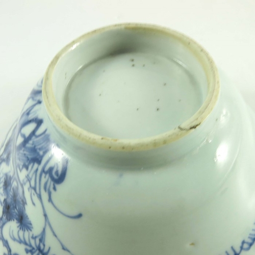 411 - A Chinese blue and white bowl, Ming, ogee form, painted with prunus, 18cm diameter