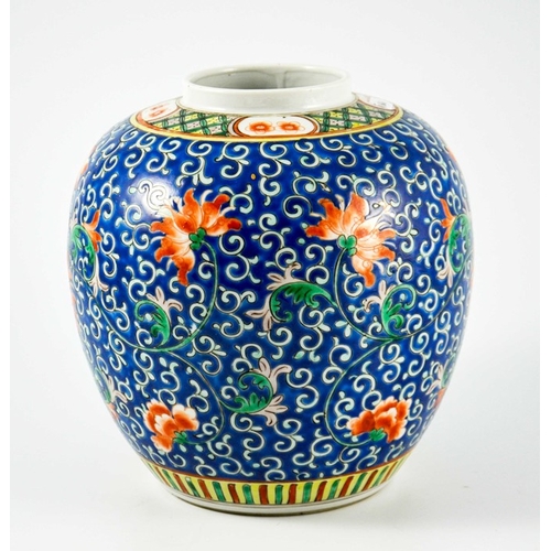 412 - A Chinese famille rose ginger jar, enamelled with lotus flowers on a blue foliate scroll ground, fou... 