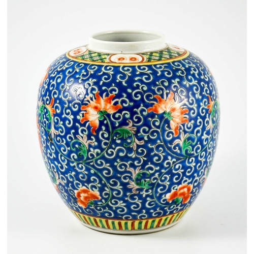 412 - A Chinese famille rose ginger jar, enamelled with lotus flowers on a blue foliate scroll ground, fou... 