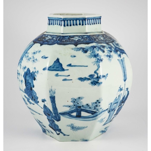 413 - A large Oriental blue and white hexagonal vase of bulbous form decorated with warriors and dignitari... 