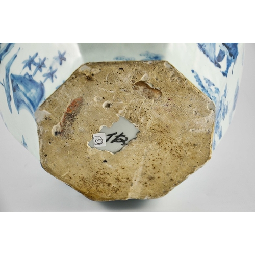 413 - A large Oriental blue and white hexagonal vase of bulbous form decorated with warriors and dignitari... 