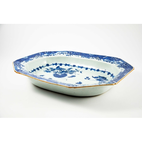 415 - A Chinese blue and white dish, 18th century, elongated octagonal form, painted with sprays of pomegr... 