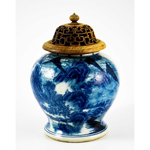 424 - A Chinese blue and white ginger jar, with reticulated hardwood cover, inverse baluster form, decorat... 