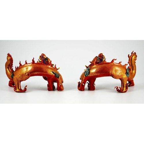 425 - A Pair of Chinese Porcelain Dragons decorated in gilt and coloured enamels on terracotta and gilt gr... 