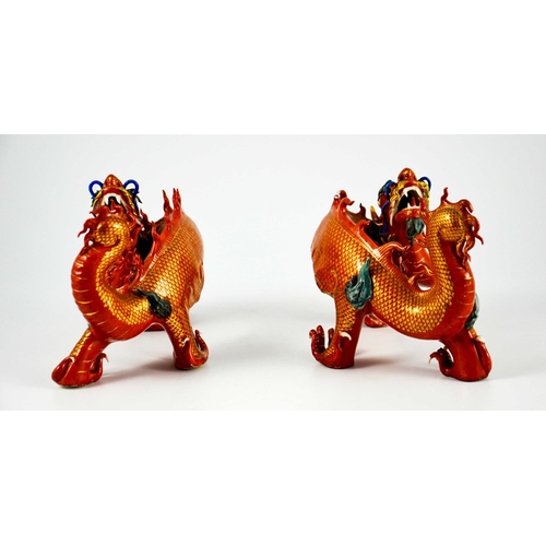 425 - A Pair of Chinese Porcelain Dragons decorated in gilt and coloured enamels on terracotta and gilt gr... 