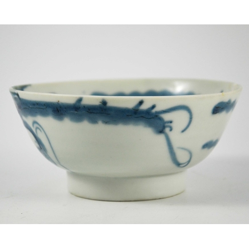 426 - An Oriental blue and white dragon bowl, painted to the interior and exterior with clouds and creatur... 