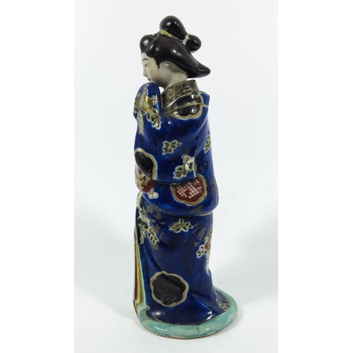 430c - A Japanese Imari figure, modelled as a Geisha, the top section removing to reveal an unclothed lower... 