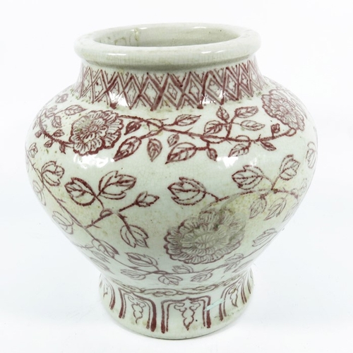 430d - An Oriental vase, inverse baluster form, painted with red floral decoration, 23cm high