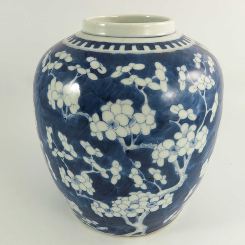 431 - A Chinese blue and white jar, Qing, painted with prunus blossom, character marks with double rings, ... 