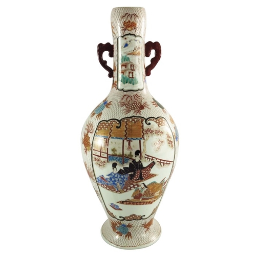 437 - A large Japanese Imari twin handled vase, painted with panels of figures with a volcanic background,... 