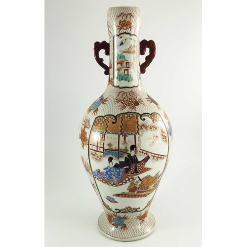 437 - A large Japanese Imari twin handled vase, painted with panels of figures with a volcanic background,... 