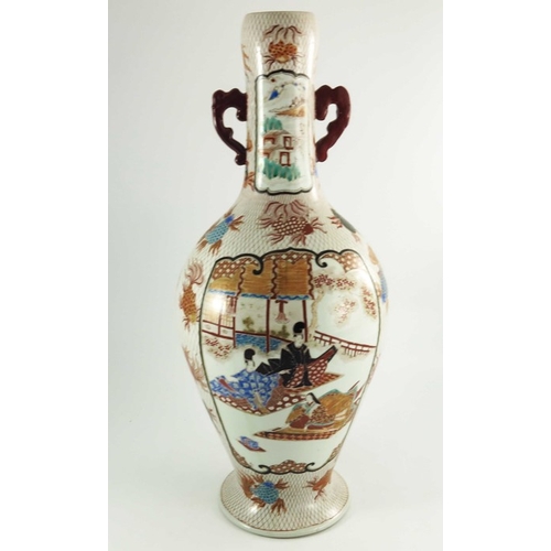 437 - A large Japanese Imari twin handled vase, painted with panels of figures with a volcanic background,... 