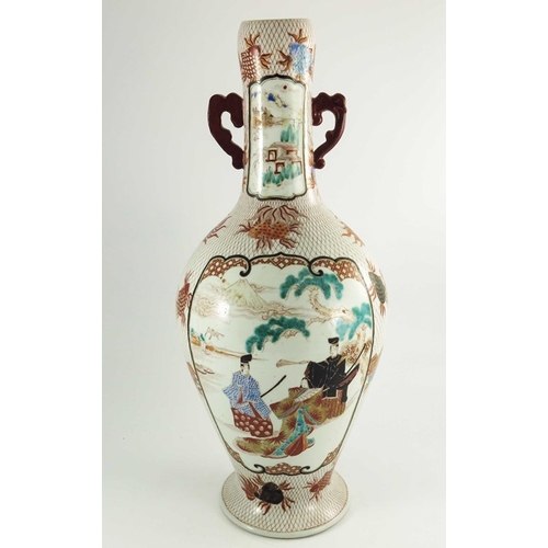 437 - A large Japanese Imari twin handled vase, painted with panels of figures with a volcanic background,... 