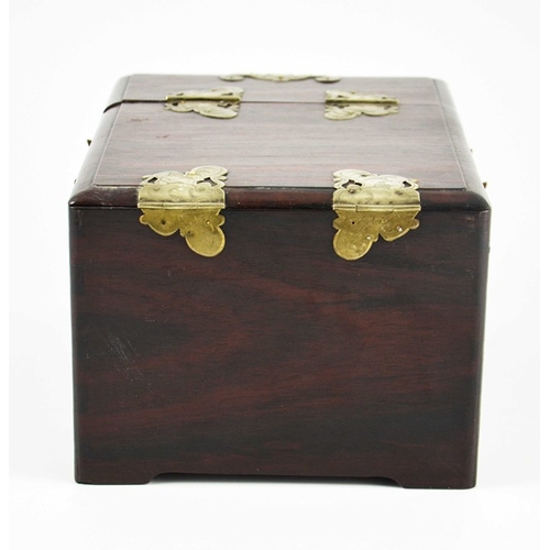 443 - A Chinese hardwood toilet chest, fitted with white metal mounts, two drawers and a double hinged lid... 