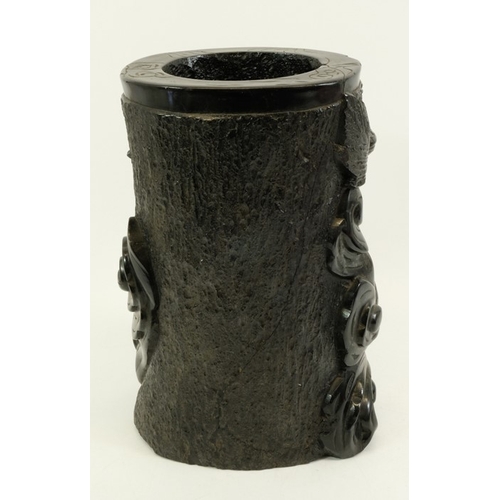 452 - A large Chinese lignite or black lacquer resin brush pot, carved with a wrythen dragon to one side, ... 