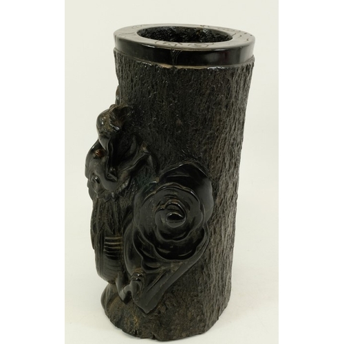 452 - A large Chinese lignite or black lacquer resin brush pot, carved with a wrythen dragon to one side, ... 