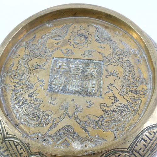 453 - A Chinese bronze censor, Xuande mark, squat baluster form, incised with figures in combat and a nobl... 