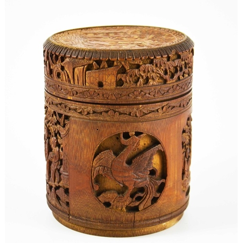 454 - A Chinese bamboo lidded brush pot, carved and blind reticulated with alternating phoenix birds and l... 