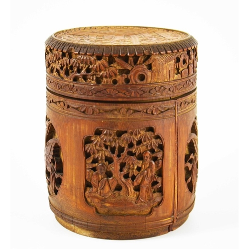 454 - A Chinese bamboo lidded brush pot, carved and blind reticulated with alternating phoenix birds and l... 