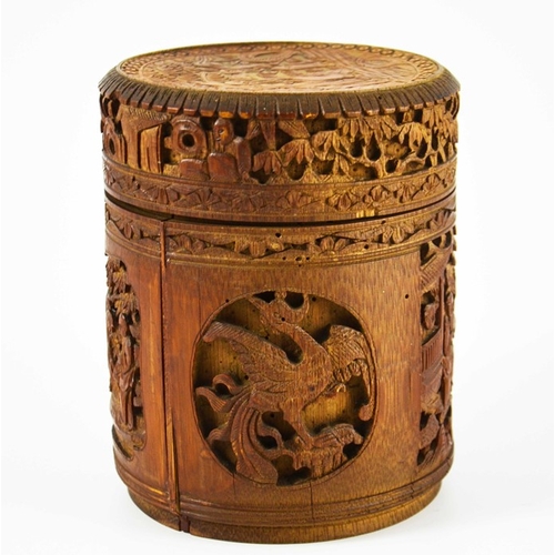 454 - A Chinese bamboo lidded brush pot, carved and blind reticulated with alternating phoenix birds and l... 