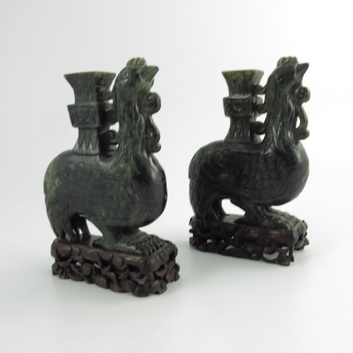 455 - A Pair of Chinese Spinach Green Jade Carved Bird Vases, cirac20th century, the carved stylised phoen... 