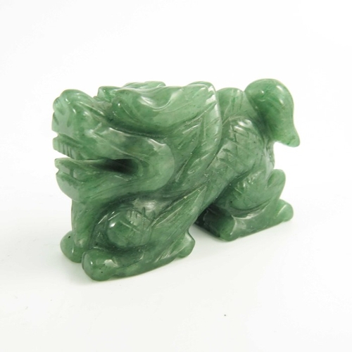 461 - A Chinese Green Jade Carving of a Miniature Dragon, 20th century, 5.4cm long