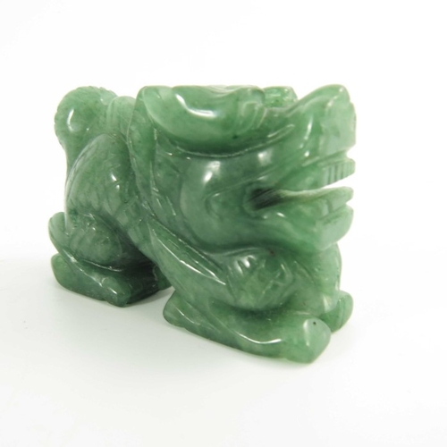 461 - A Chinese Green Jade Carving of a Miniature Dragon, 20th century, 5.4cm long