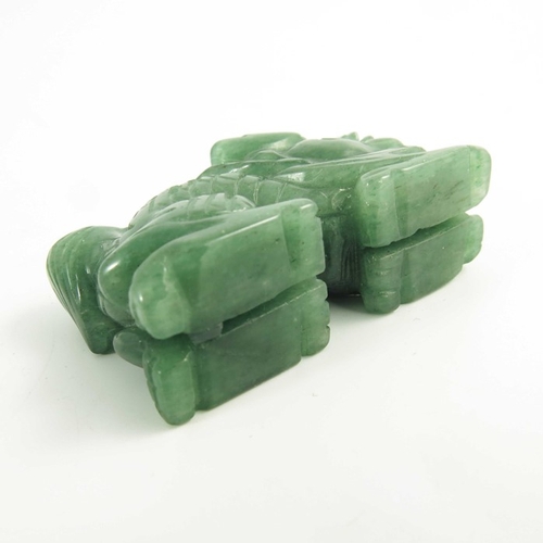 461 - A Chinese Green Jade Carving of a Miniature Dragon, 20th century, 5.4cm long